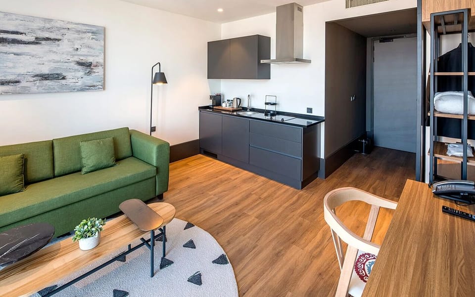 Enjoy effortless meals with a sleek kitchenette and lounge space.