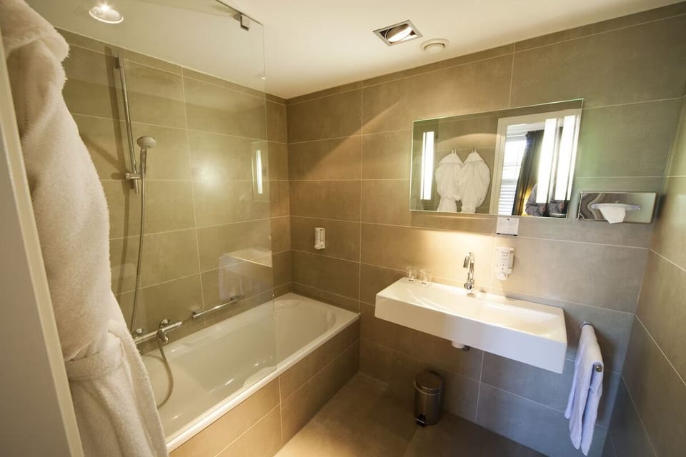 Unwind with a hot soak in a spotless, tiled sanctuary.