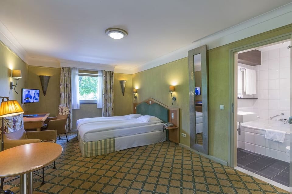 Unit with 2 Single beds. Exact unit will be assigned upon arrival. Views, colors, and decor may vary.