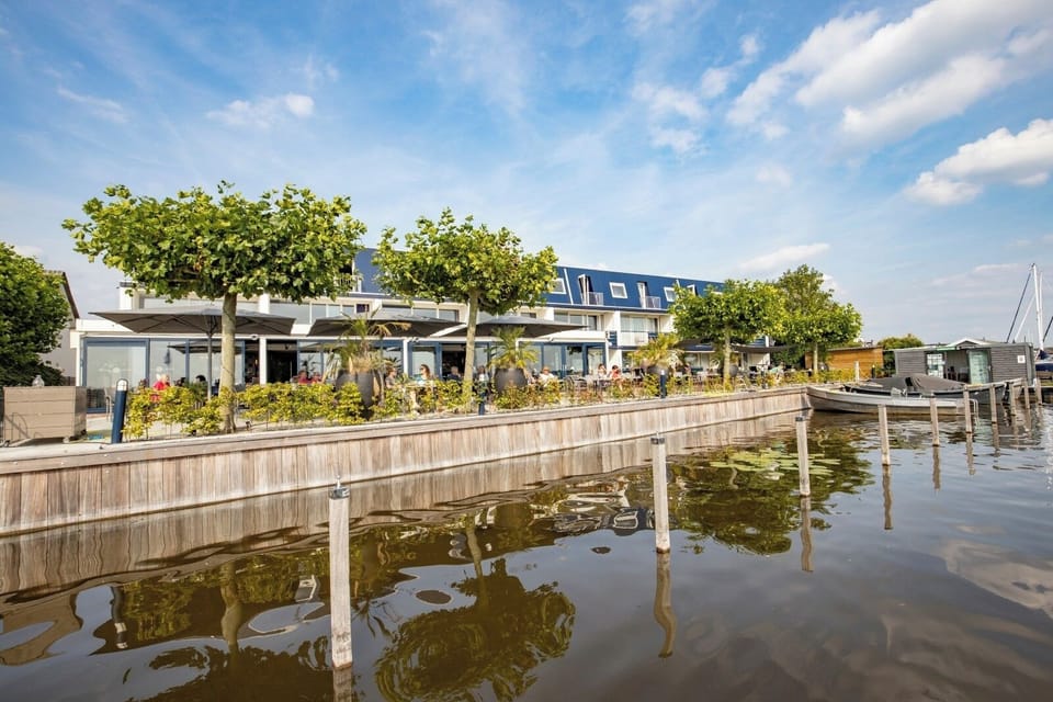 Arrive to a chic waterfront escape with sunny dockside vibes.