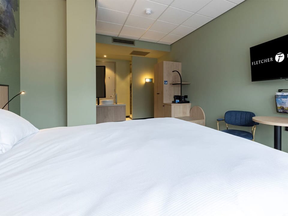 Recharge in a spacious room with seating and easy-flow layout.