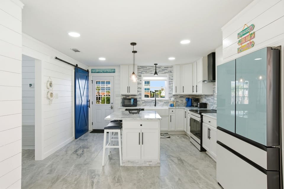 A Beautifully Remodeled Kitchen With Updated Appliances