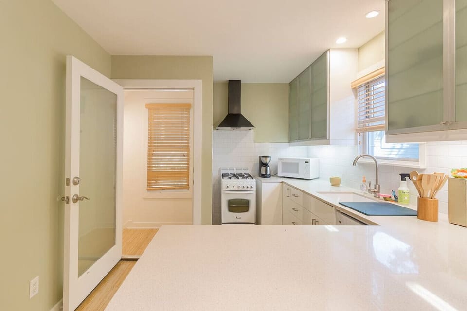 Sleek sage walls and plenty of counter space for your inner chef.