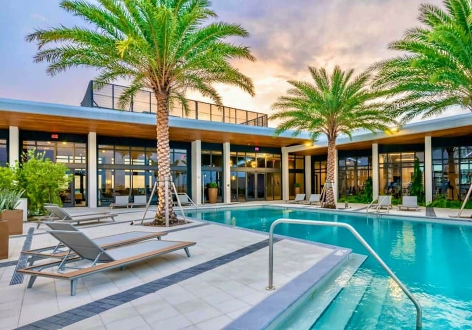 Stunning rooftop pool with cabanas — relax under the Florida sun.