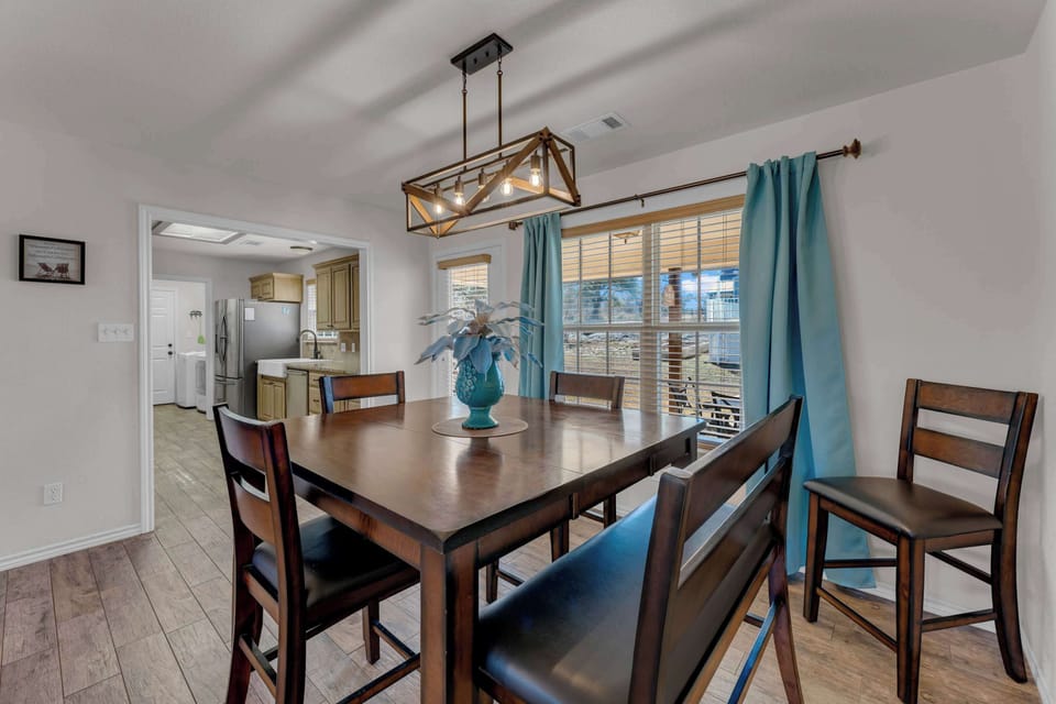 Dining table seats 5 with an additional chair for more seating