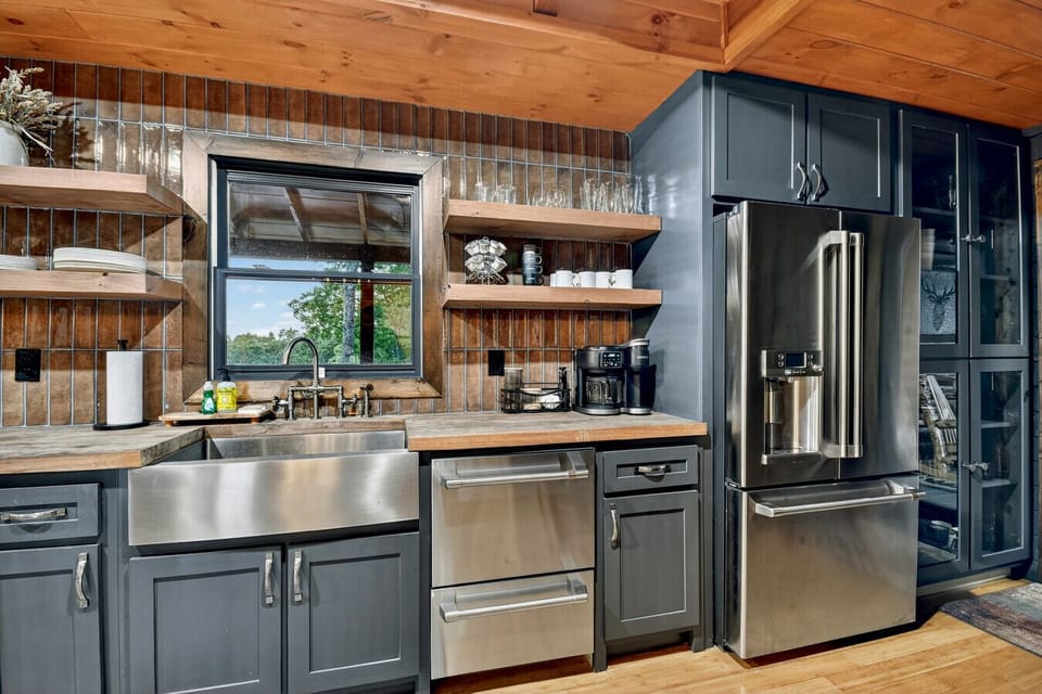 Fully Equipped Stainless Steel Kitchen with Open Dining Area