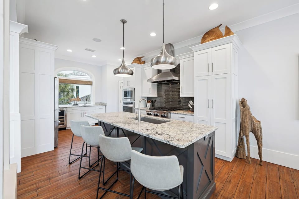 Your dream chef's kitchen awaits with granite countertops, premium appliances, and a spacious island perfect for morning coffee or evening meals.