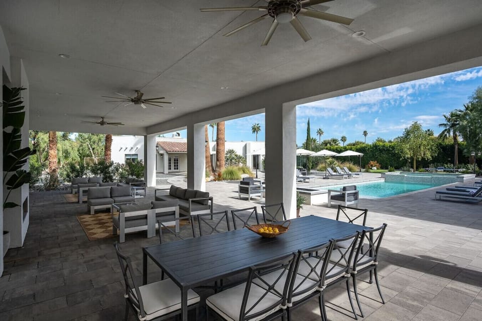 Covered Gazebo: Natural gas stainless steel grill, dual stove, kebab grill, 10-person dining table for al fresco dining, 2 conversation seating area, 75` smart tv, natural gas fire place, 2 large ceiling fans
