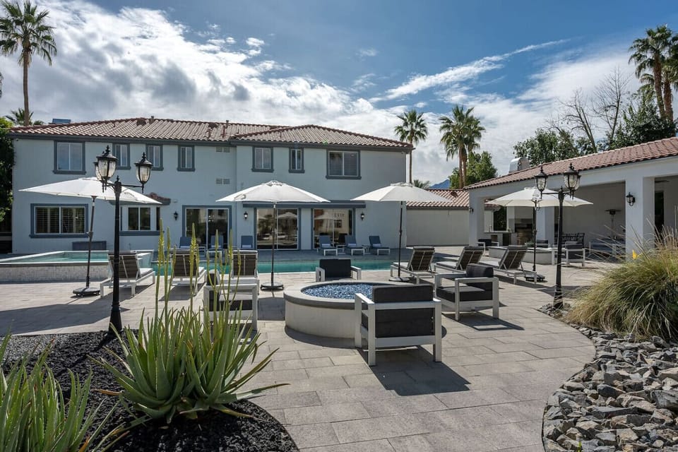 Pool: expansive pool & spa, 12 sun loungers, side tables, 4 patio umbrellas, 2 natural gas fire pit with additional seating