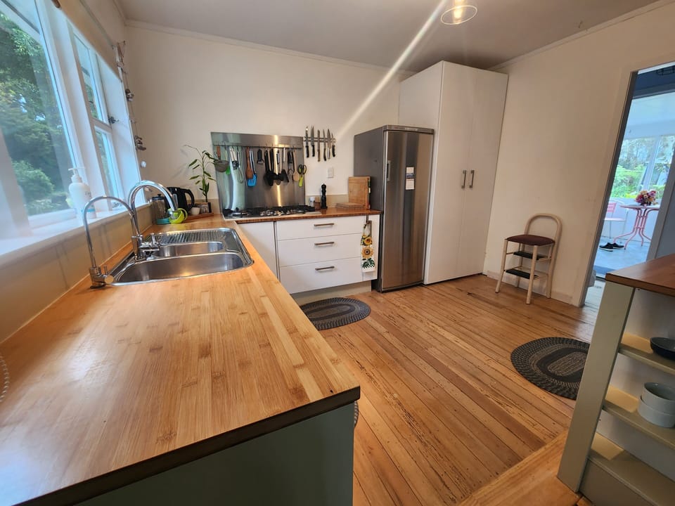 Kitchen with a view to entrance driveway, and outdoor enclosed space