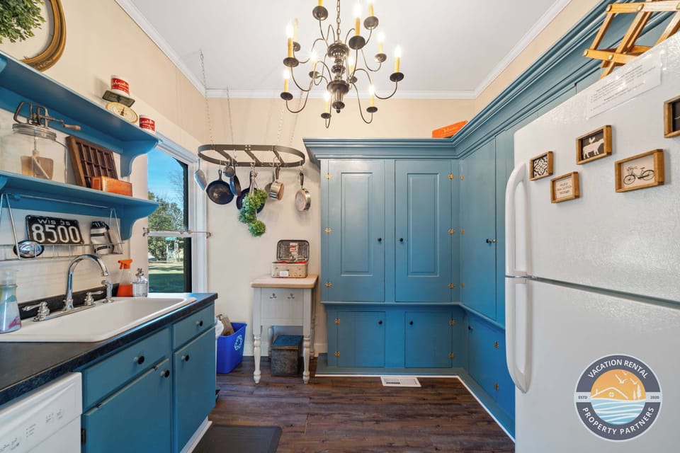 Spacious kitchen with modern appliances thoughtfully integrated into the home’s historic design. Ideal for cooking together after a day hiking, golfing, or exploring the countryside.