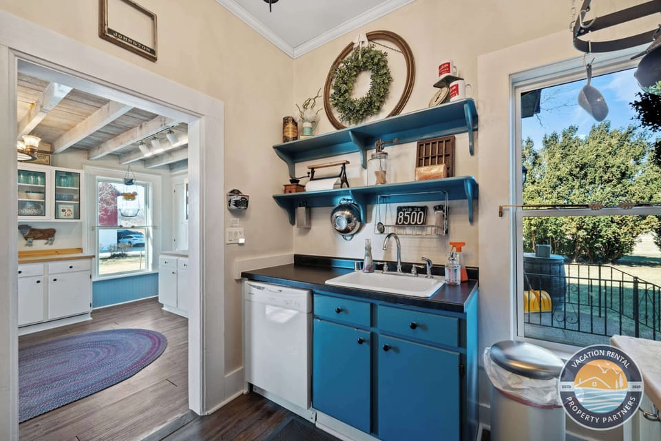 Spacious kitchen with modern appliances thoughtfully integrated into the home’s historic design. Ideal for cooking together after a day hiking, golfing, or exploring the countryside.