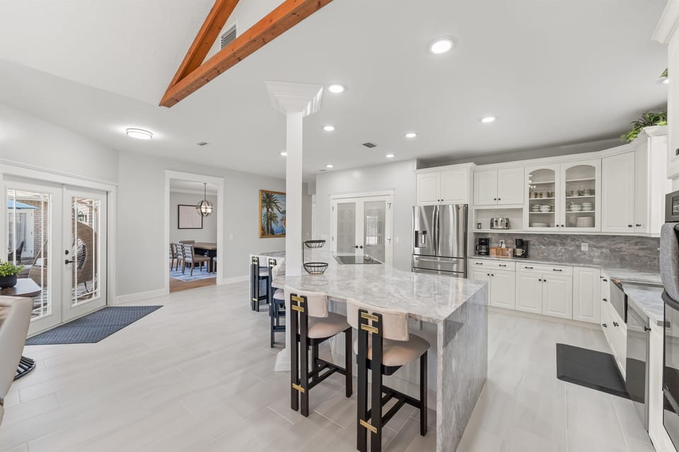 Open-concept chef’s kitchen with island seating for six.
