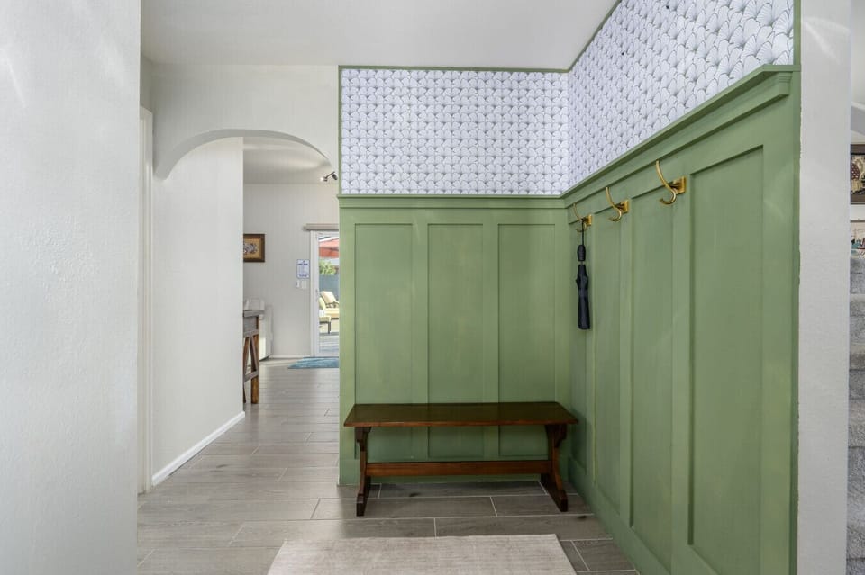 Step inside to a beautifully designed mudroom that makes organization stylish.