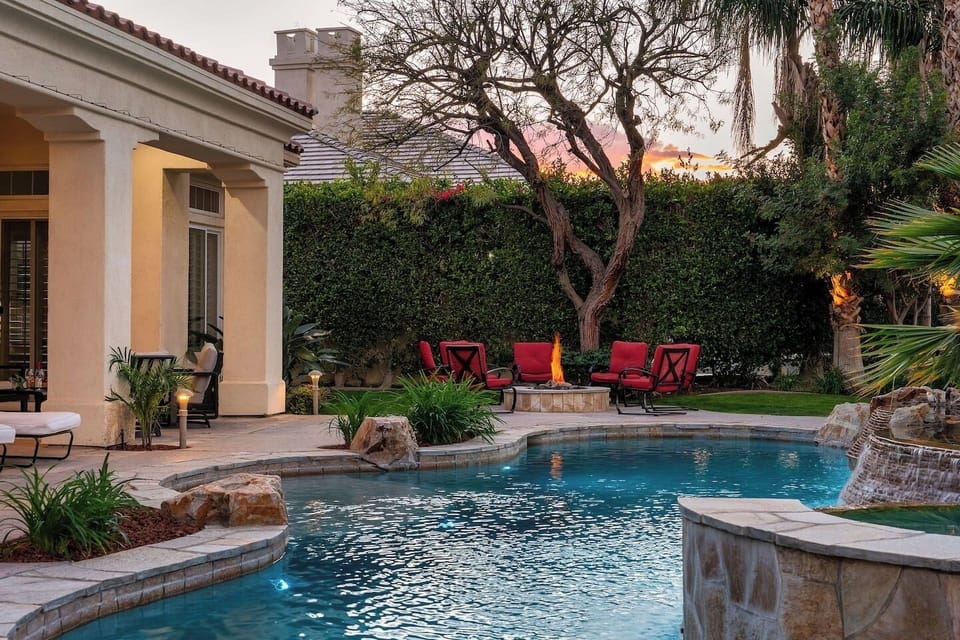 Backyard: pool and spa, natural gas fire pit with 8 chairs, natural gas fire pit, (2) sun loungers with a patio umbrella