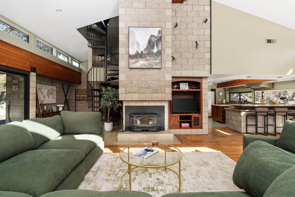 Large cozy family room with wood burning fireplace to keep you cozy all year long