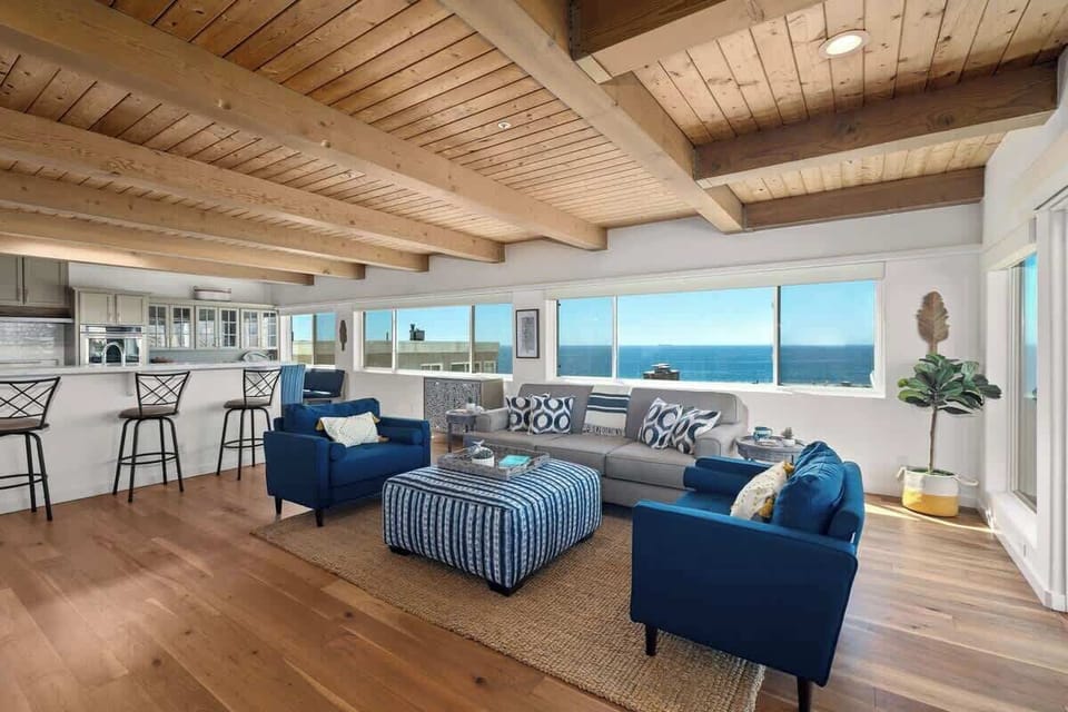 Spacious open layout connecting the living room and kitchen, designed for relaxing, gathering, and enjoying the ocean views.
