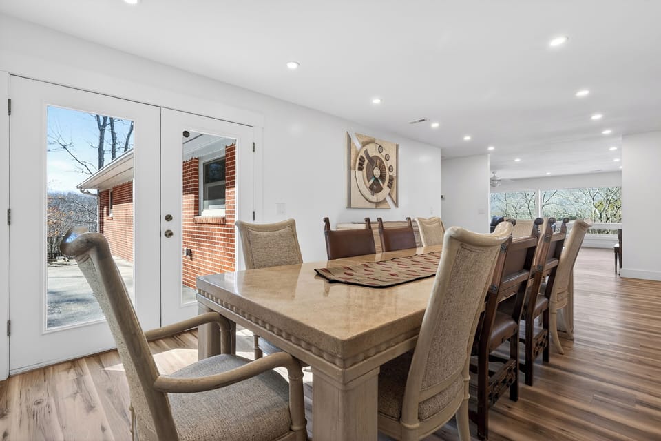 Gather for memorable meals at the spacious dining table—easy access to the patio for indoor-outdoor flow.