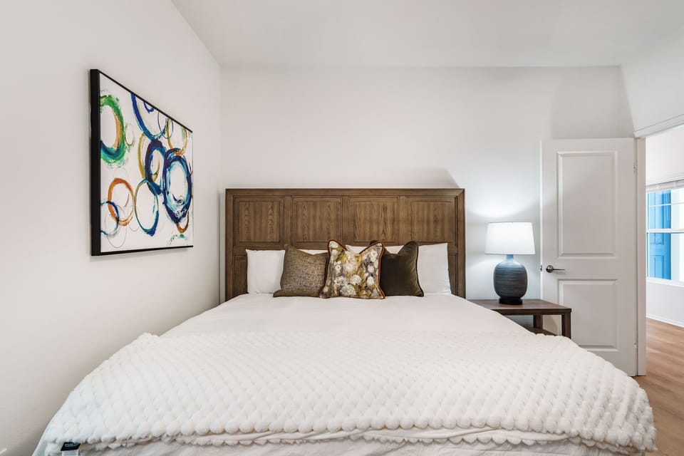 Unit 6: Bedroom 2 features a queen bed.