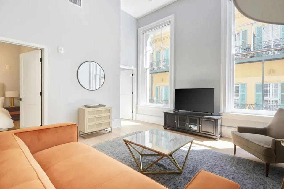 Living room with plush seating and a TV.