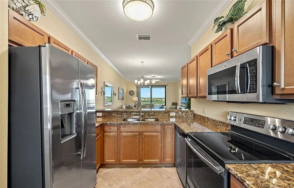 Kitchen with updated appliances. Fully stocked with everything you need.