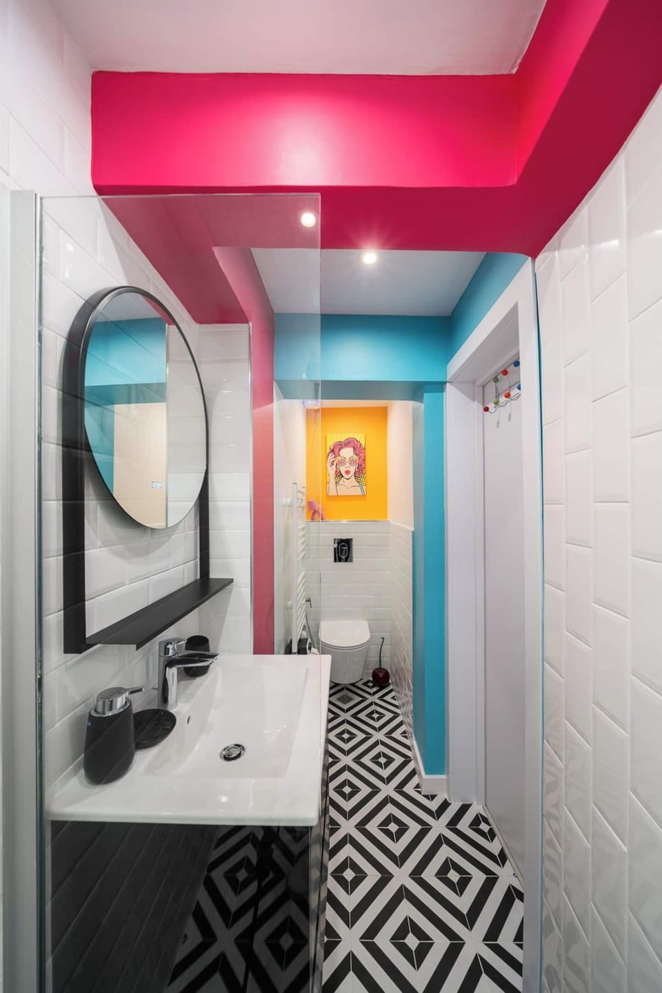 Art doesn't stop at the bedroom door — a teal-ceilinged bathroom with gallery-worthy details at every turn