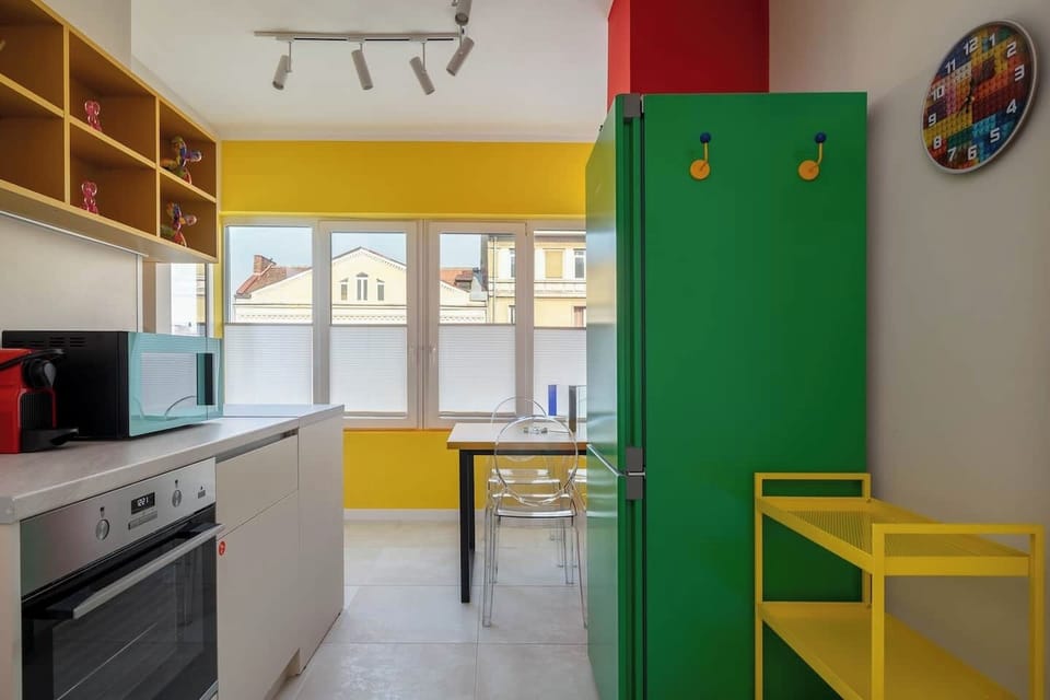 The icon of the kitchen — a statement green fridge that turns the most functional room into the most photographed one