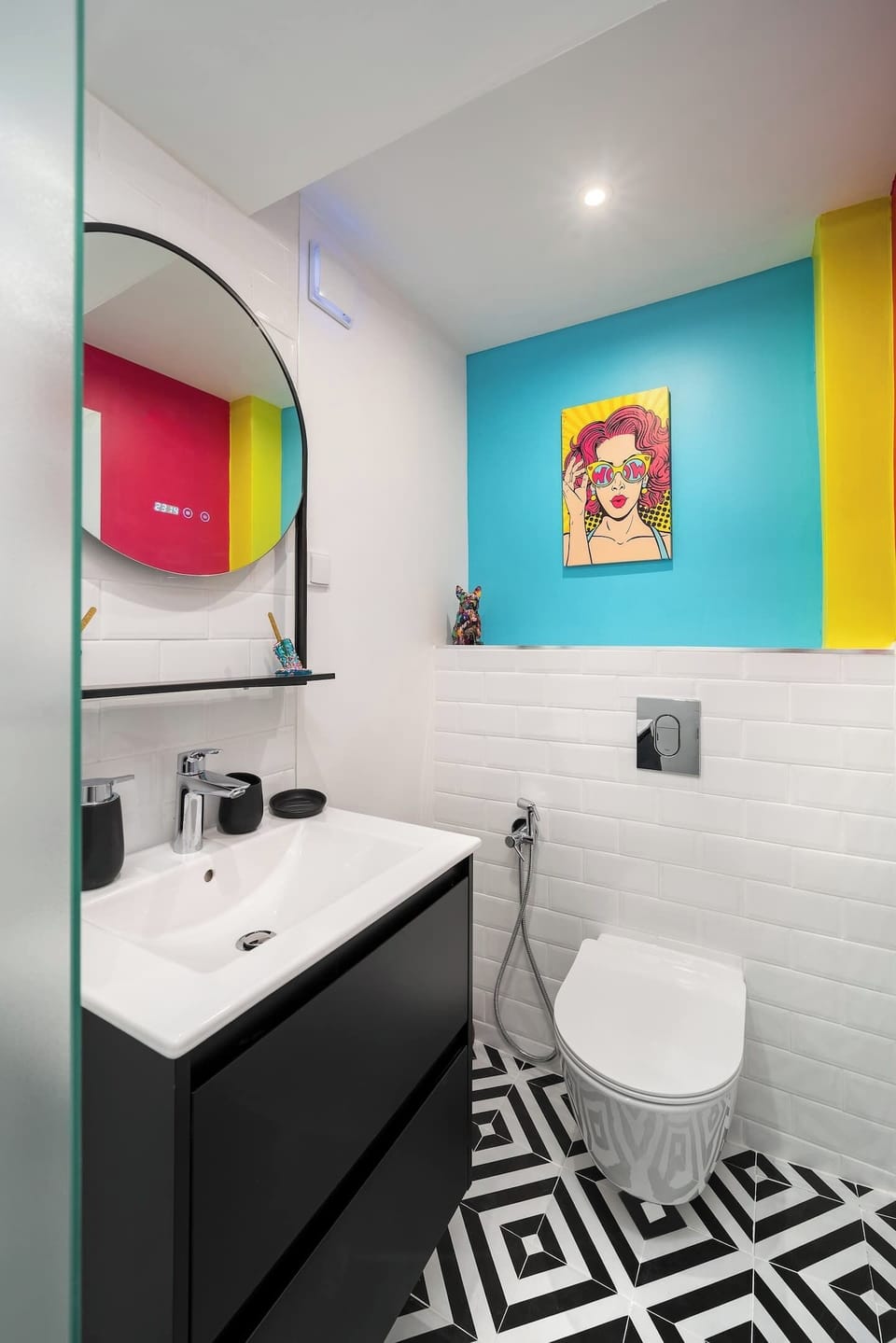 Art follows you everywhere — a bright, modern bathroom where colour and creativity don't stop at the bedroom door