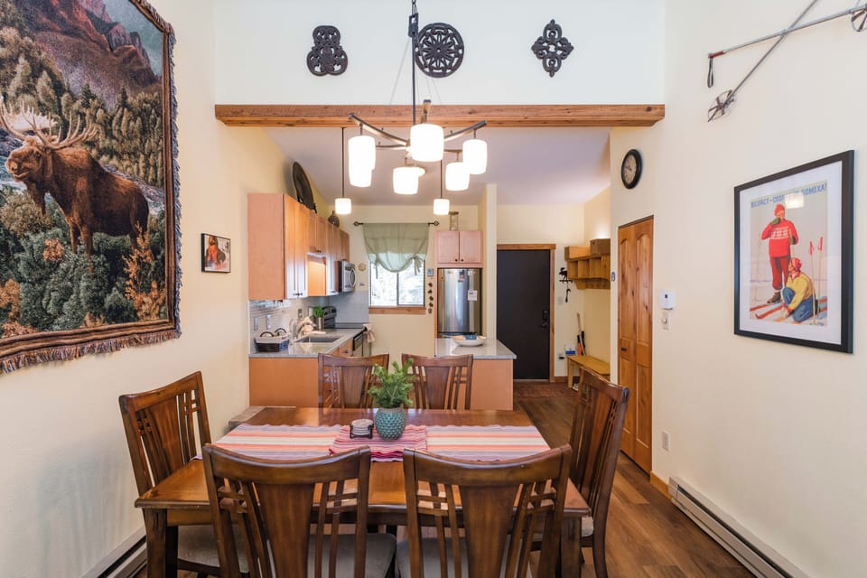 Gather around your welcoming dining table, where rustic charm meets mountain comfort in this thoughtfully decorated space.