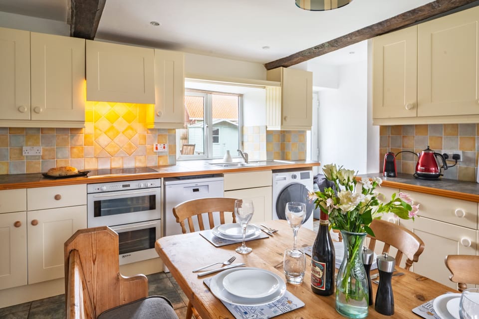 Ground floor: The pretty country-style kitchen is well equipped