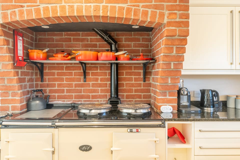 Ground floor: Kitchen / breakfast room with oil-fired Aga, electric oven, induction hob, large fridge/freezer, microwave, dishwashers, coffee machine and a full inventory of table and kitchenware and breakfast table for six people