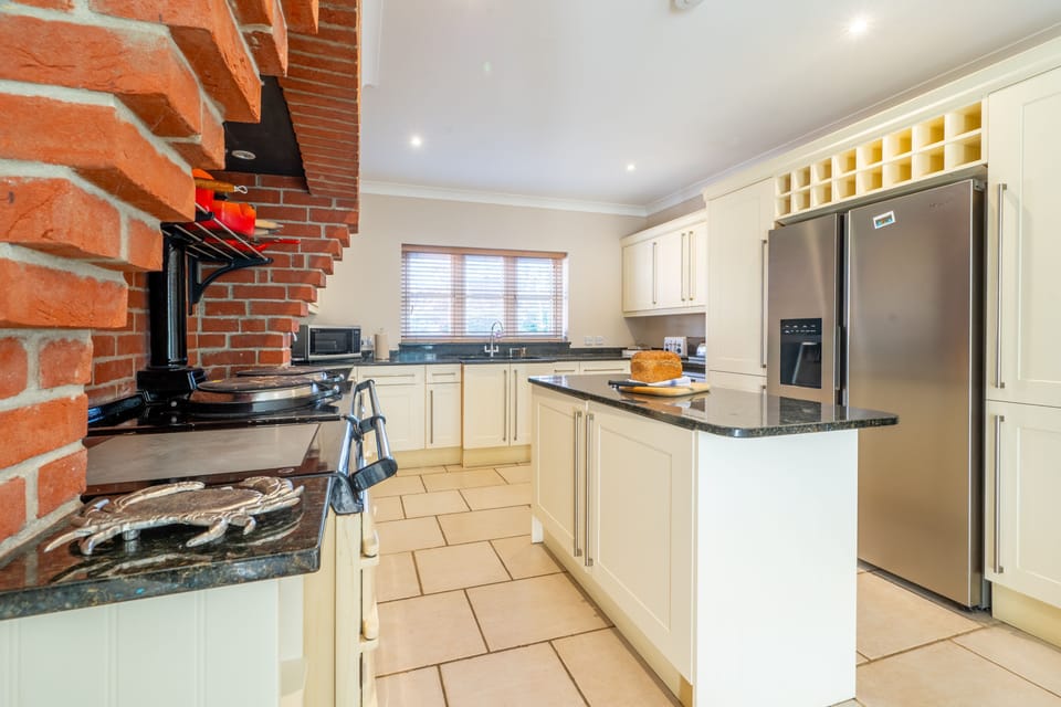 Ground floor: Kitchen / breakfast room with oil-fired Aga, combination microwave that has a grill / oven function, large fridge/freezer, dishwashers, coffee machine and a full inventory of table and kitchenware and breakfast table for six people