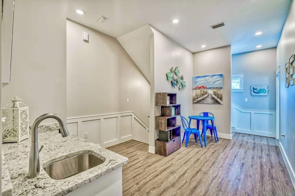 2nd Floor - Lounge area with comfortable seating and Smart TV, plus a built-in wet bar featuring a coffee maker, mini fridge, and sink—perfect for morning coffee, evening drinks, or a private upstairs retreat.
