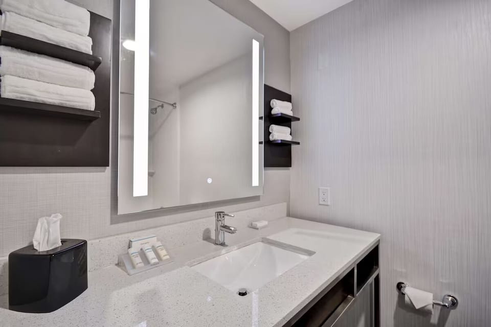 Refresh easily at the spotless vanity with bright, flattering lighting.