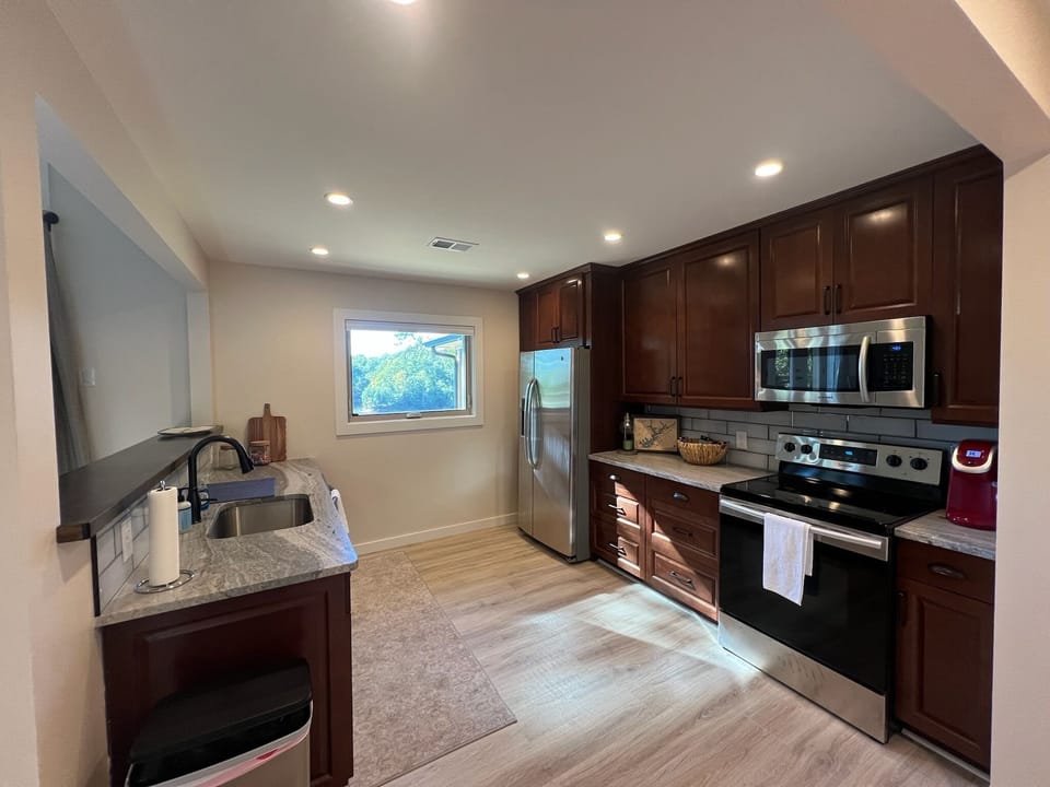 Kitchen area with beautiful lake breeze to enjoy while you cook.