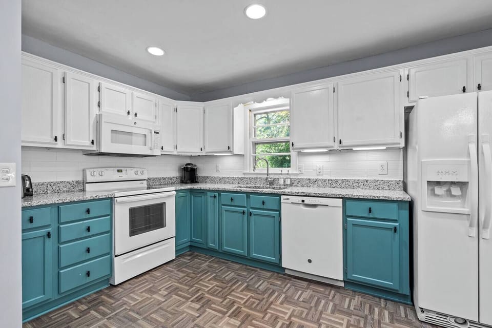Fully equipped kitchen with plenty of space for group meals and morning coffee together.