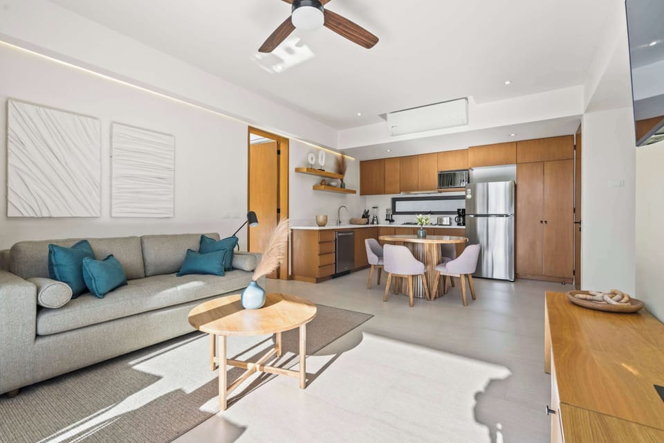 Living room with access to the private balcony and sofa bed 