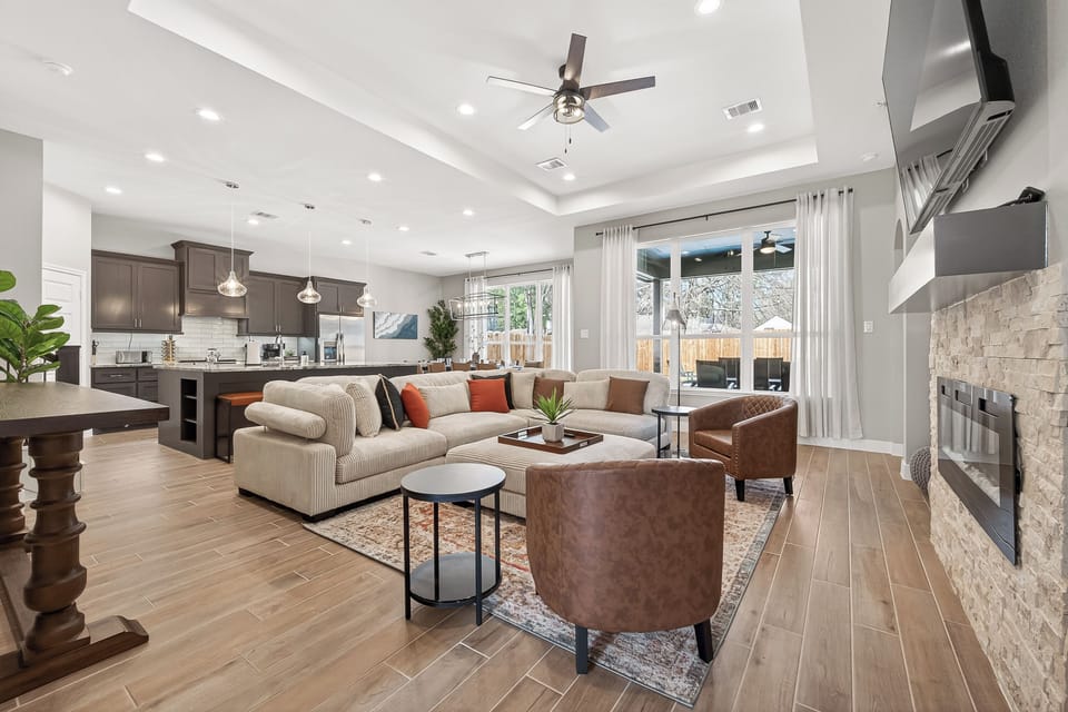 Spacious open-concept living area with modern design and abundant natural light.