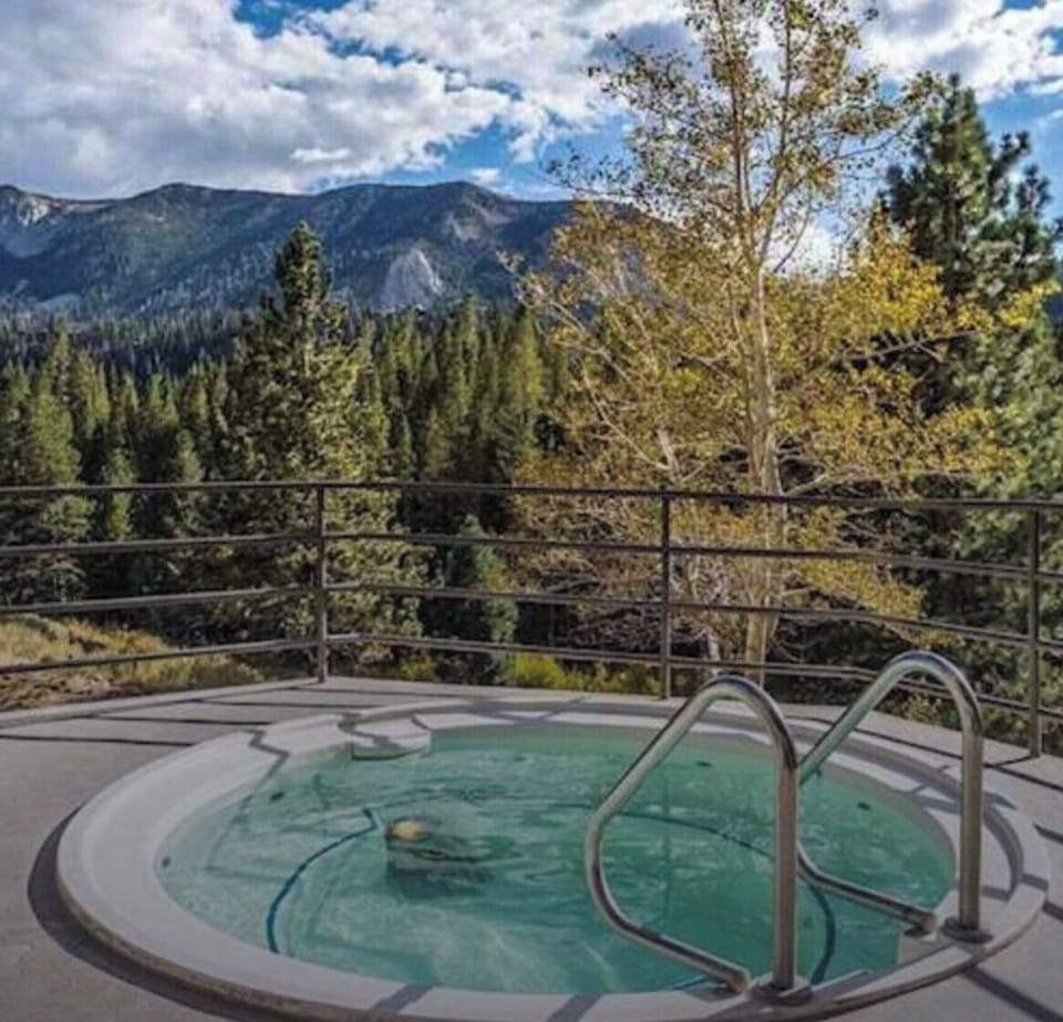 Mountain-View Hot Tubs Under Brilliant Blue Skies or Dark Starry Nights