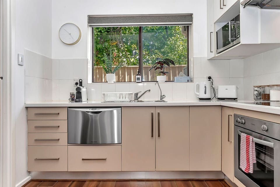 Cleanup is easy with our modern dishwasher and spacious sink area overlooking the garden.