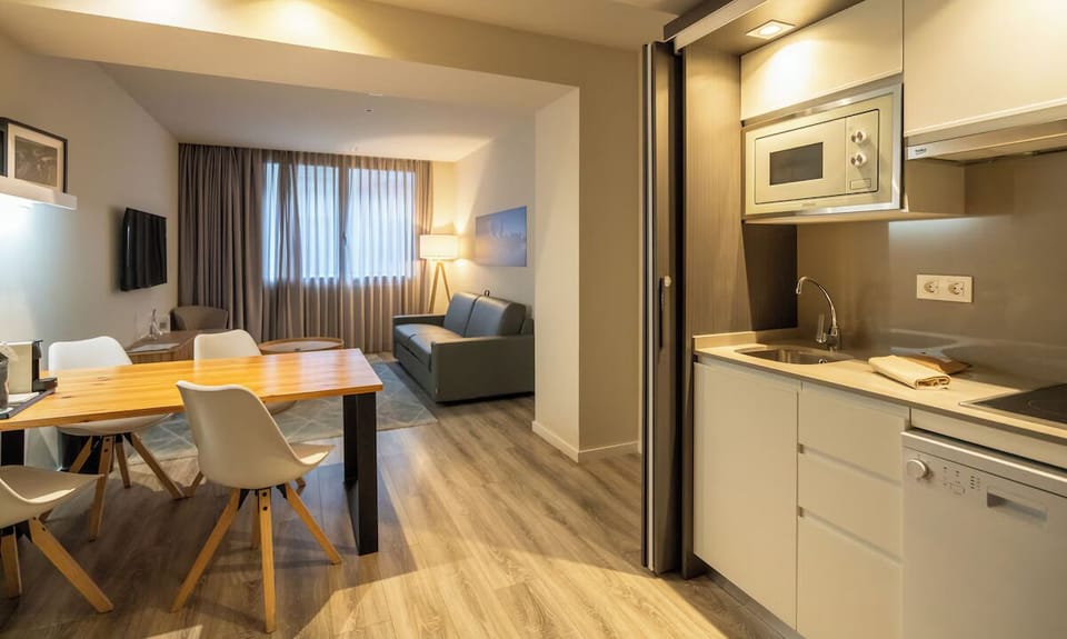 Settle in with a sleek kitchenette beside the relaxing lounge.