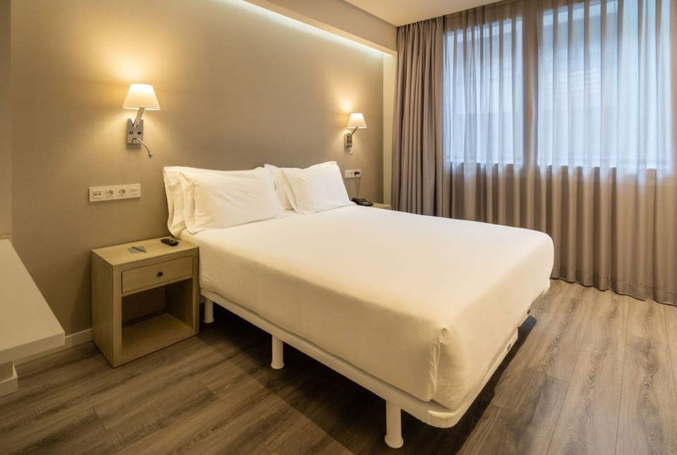 Unwind in crisp linens and soft, calming ambient light.