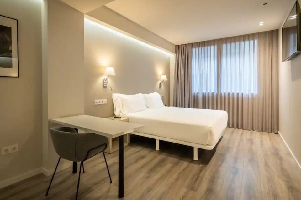 Start your day refreshed in this serene, minimalist sleeping space.
