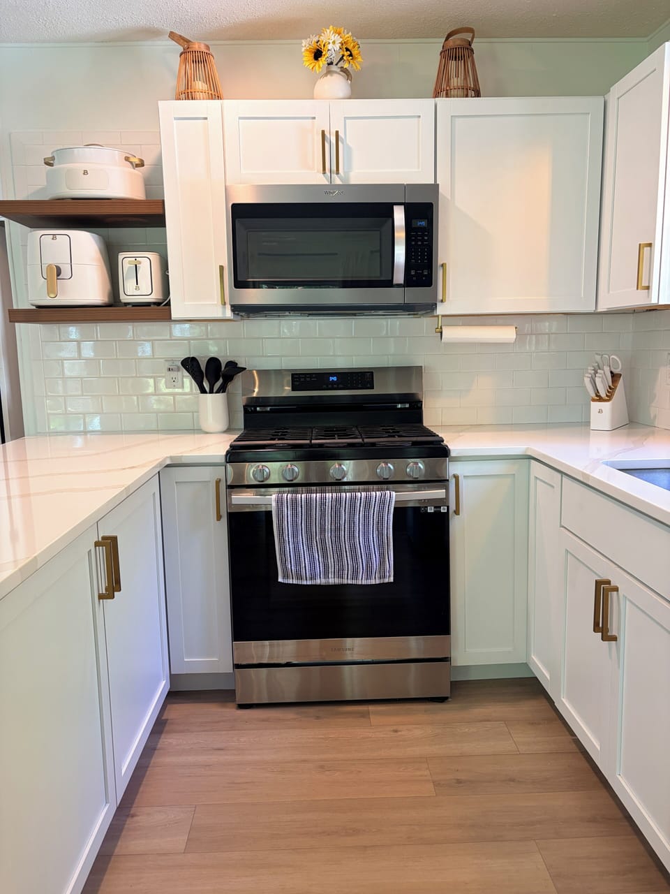 Bright modern kitchen with stainless appliances and stylish finishes