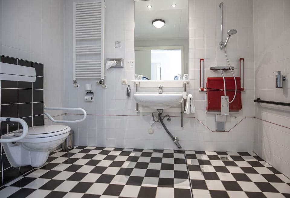 Freshen up comfortably in a spacious, accessible walk-in shower.