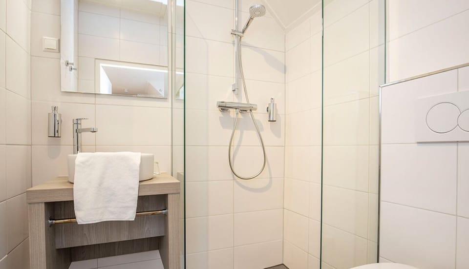 Rinse off in a bright, modern shower enclosure