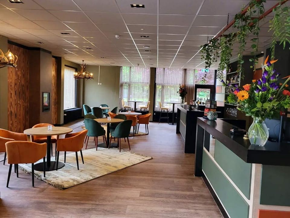 Unwind with coffee in a bright, stylish lounge setting.