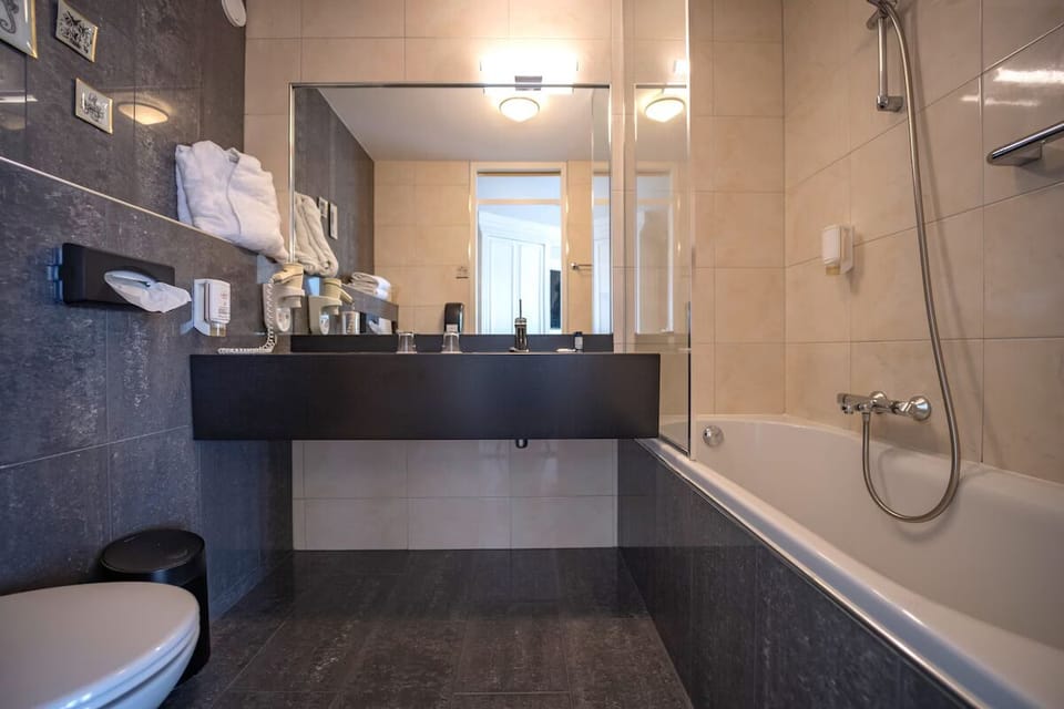 Refresh with a deep soak in a spotless, modern bath.