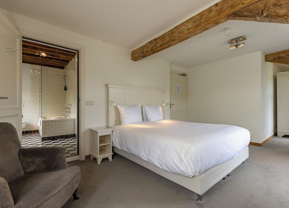 Step from bed to bathroom effortlessly in this comfortable suite.