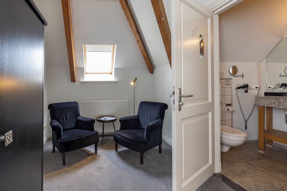 Sip coffee by the skylight in plush velvet chairs.